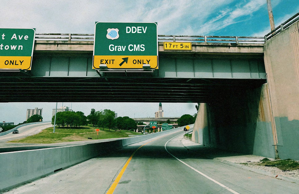 Road exit sign with "Grav CMS" text. Original image by Skyler Smith at Unsplash.com